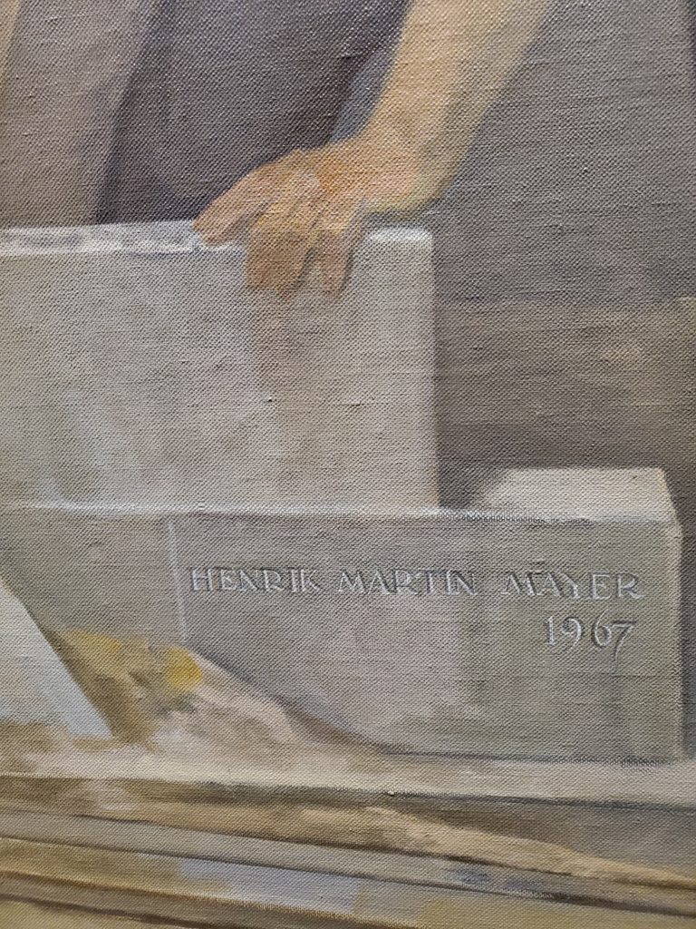 The mural is signed by the artist.
