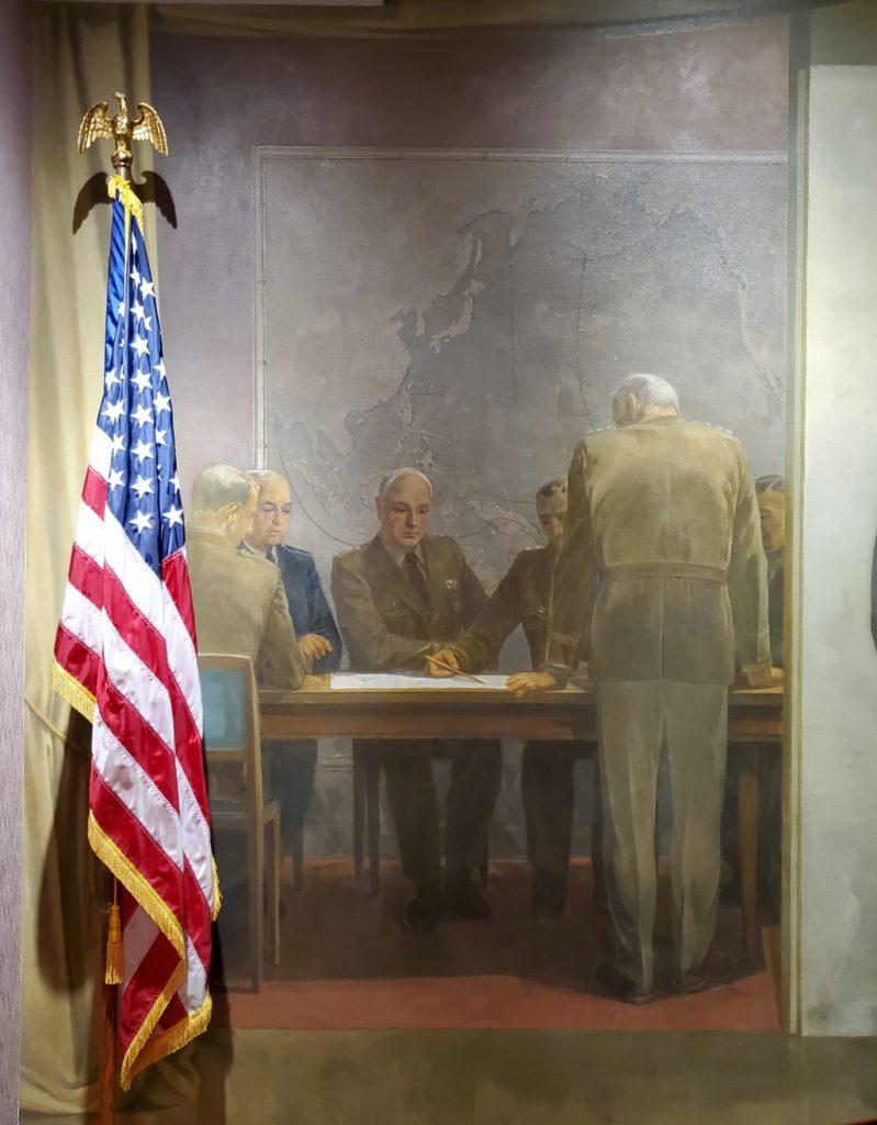 The military group to the left of the central figure represents those critical to winning World War II.