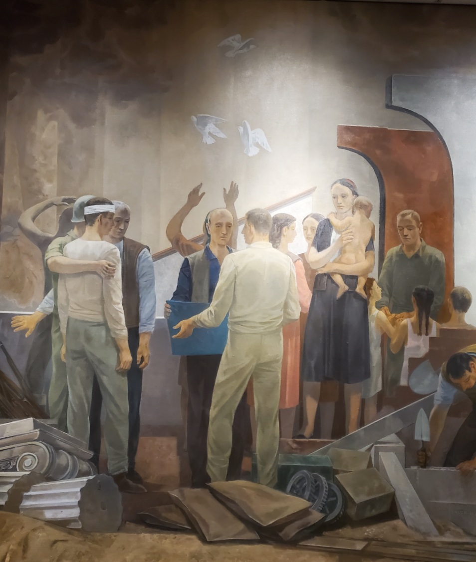 Marshall's service as a great humanitarian and author of the Marshall Plan is symbolically depicted on the right by a Europe rising from the destruction of war.