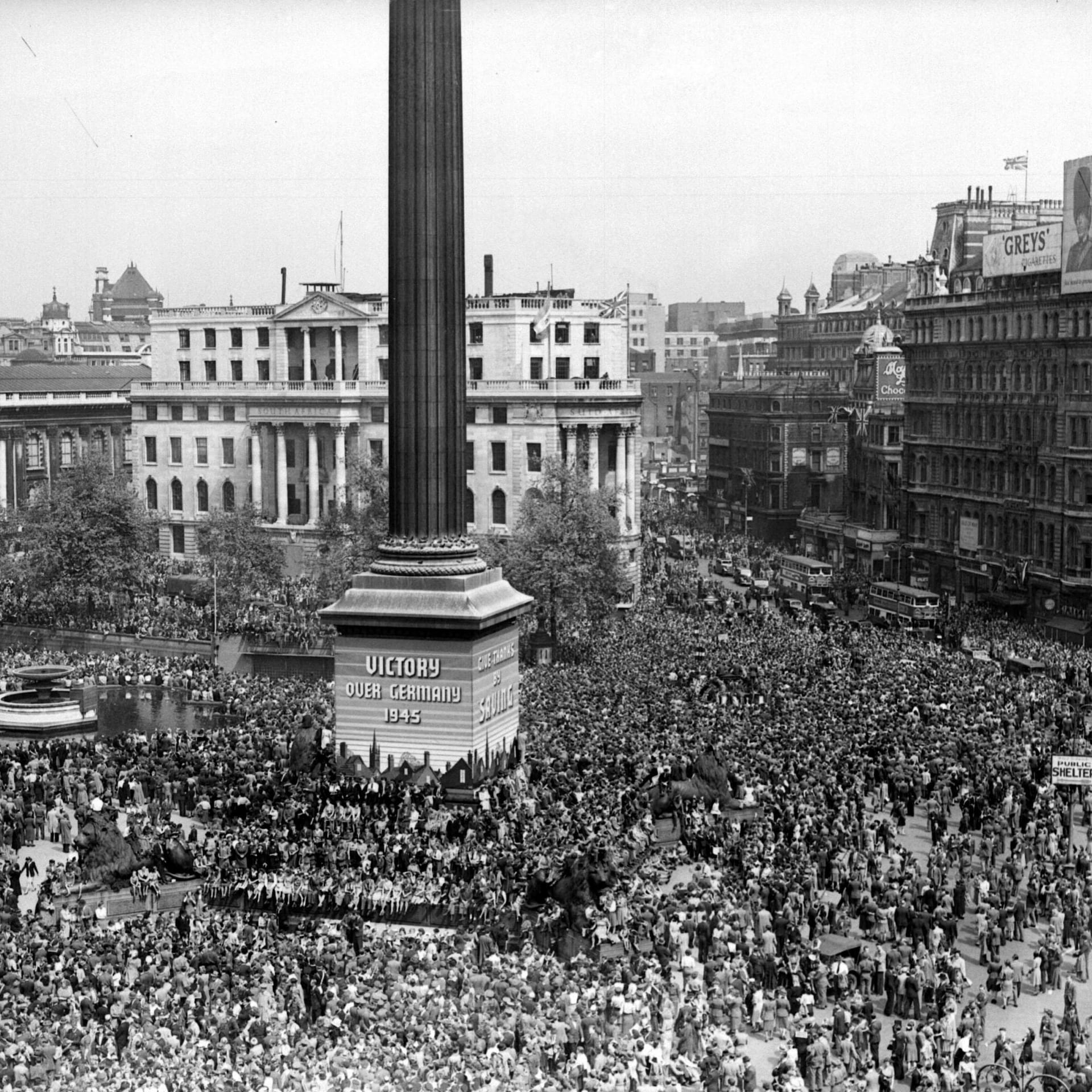 Crowds in Trafalgar Square celebrating.