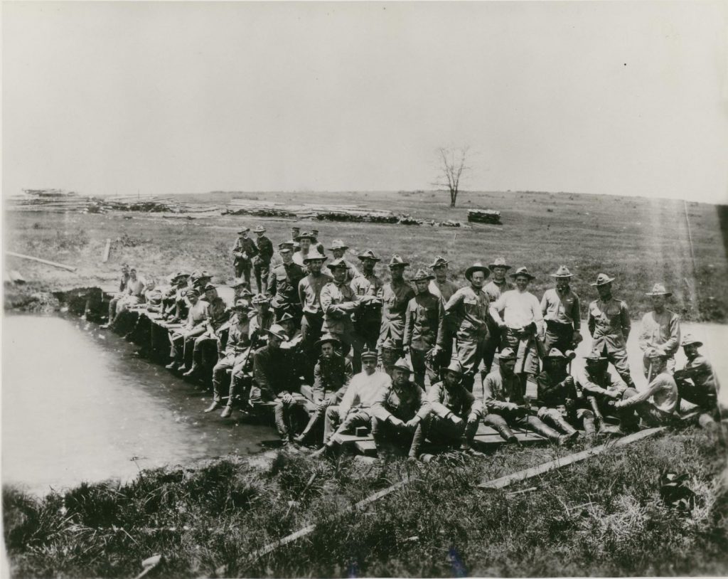 Bridge built -- Marshall is in the dark uniform, far left, second row