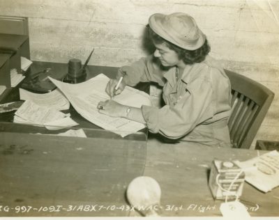 WAC enlisted woman doing paperwork at March Field.