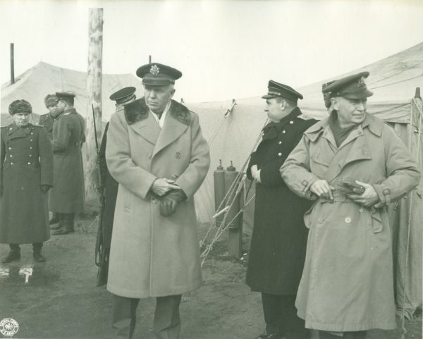 Gen. Marshall at Saki Airfield with breakfast tents in the background.