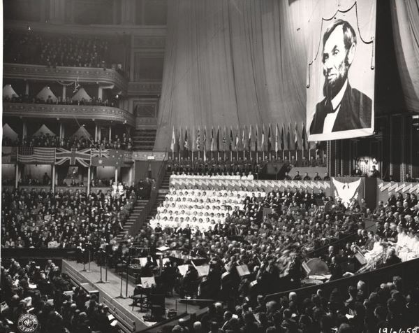 The American-British Commonwealth Sponsor a Thanksgiving Tribute to America at the Royal Albert Hall. A huge Portrait of Abraham Lincoln Dominates the stage.